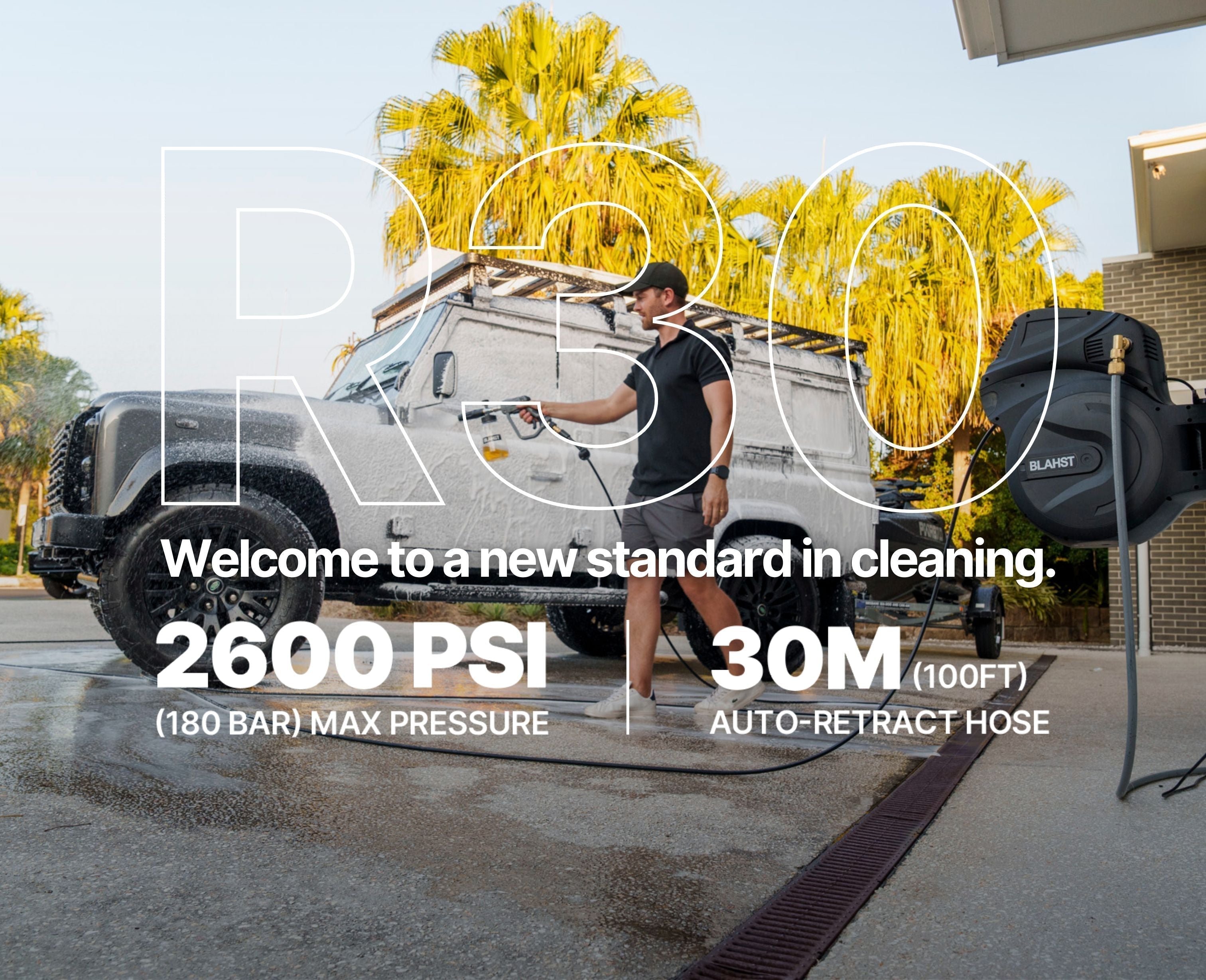 BLAHST R30 pressure washer to clean a foam-covered 4x4 in a driveway