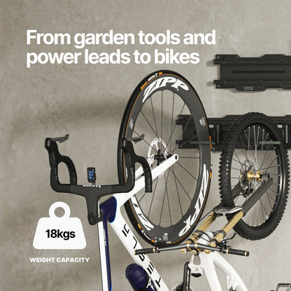 Bicycle wheel hung on a BLAHST Modular Single Hook mounted on a garage wall rail