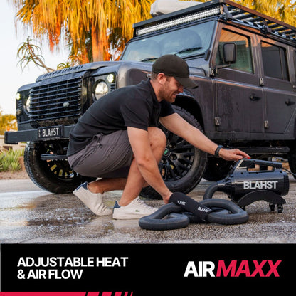 BLAHST Air Maxx Dryer with long hose stretched across a driveway to a boat trailer
